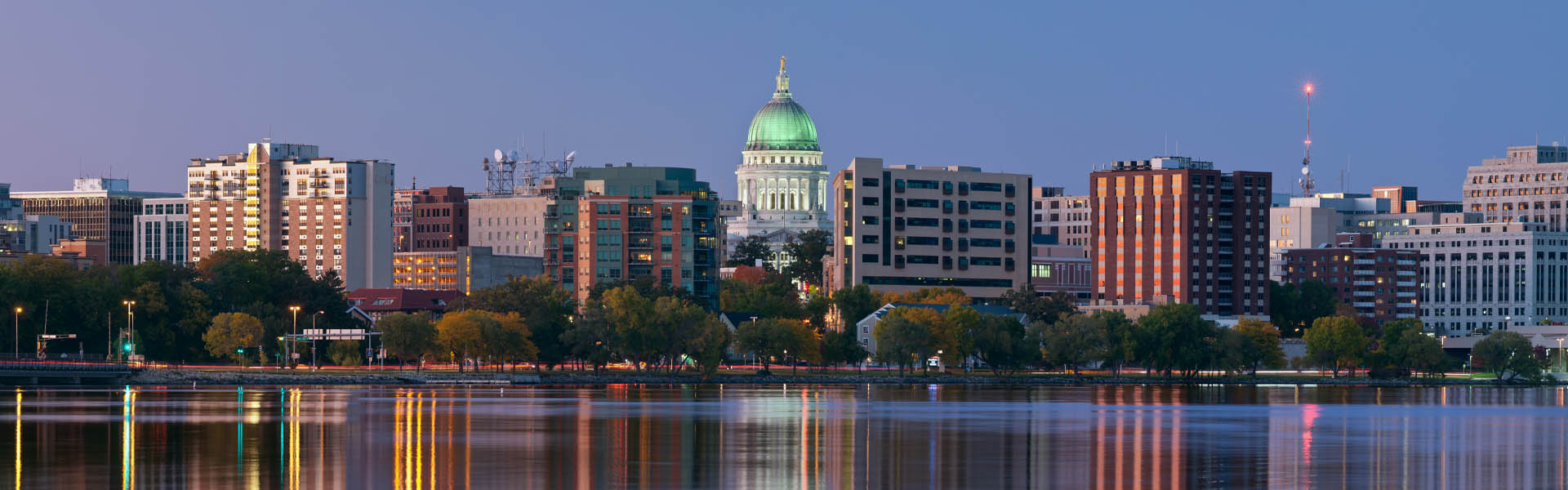 Neon color image of a band playing and people singing along
