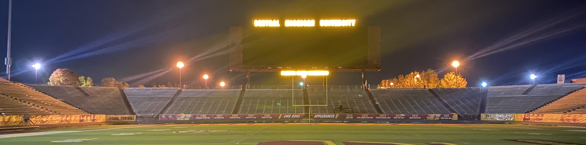 empty football stadium at night under the lights Madison